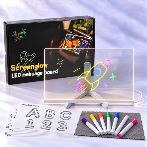 ScreenGlow LED drawing board 12 x 8 in lit up with a neon rocket, with the box, 7 neon markers on a gray cloth and tracing sheets